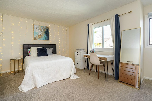 carpeted bedroom with baseboards, a textured ceiling, and wallpapered walls