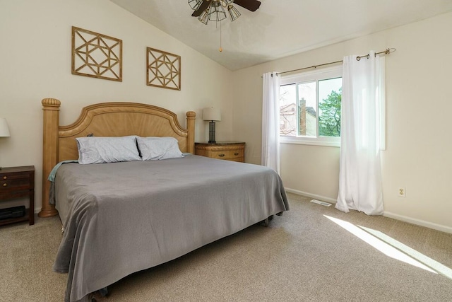 carpeted bedroom with visible vents, ceiling fan, baseboards, and lofted ceiling