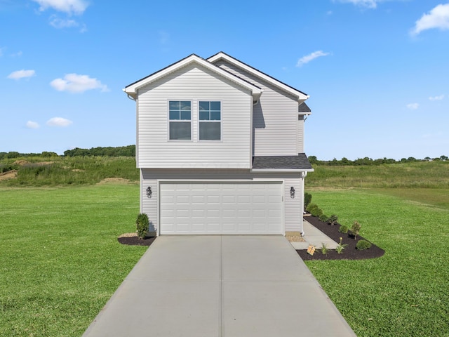 view of front facade with an attached garage, concrete driveway, and a front yard