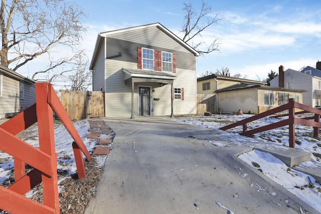 view of front of house with fence