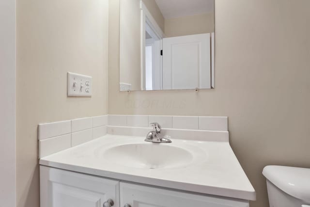 half bath with toilet and vanity