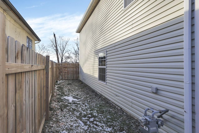 view of side of property with fence