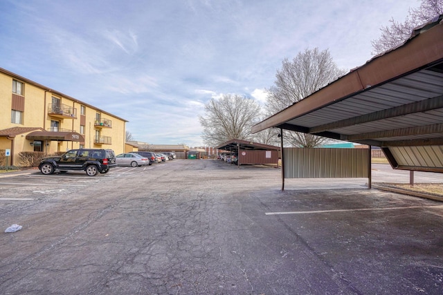 view of partially covered parking lot