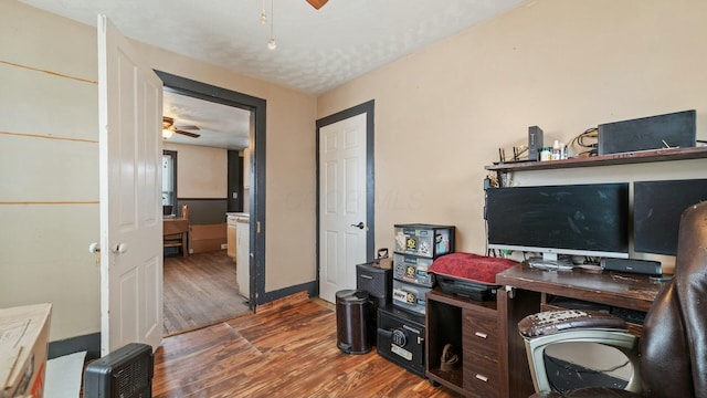 home office with ceiling fan and wood finished floors