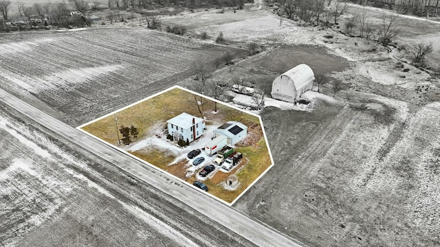 birds eye view of property with a rural view