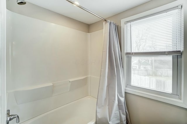 full bath featuring shower / bath combination with curtain