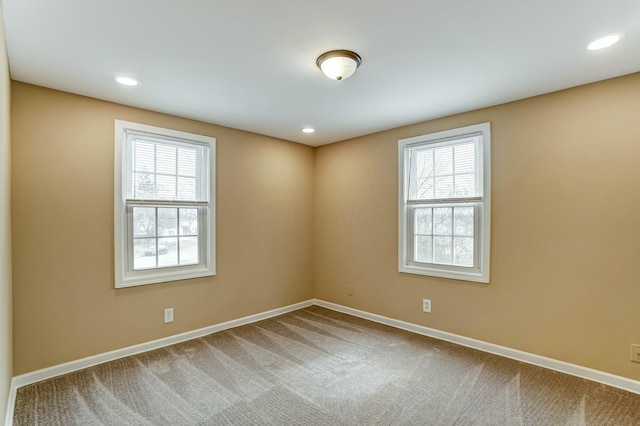 unfurnished room with carpet, baseboards, and recessed lighting