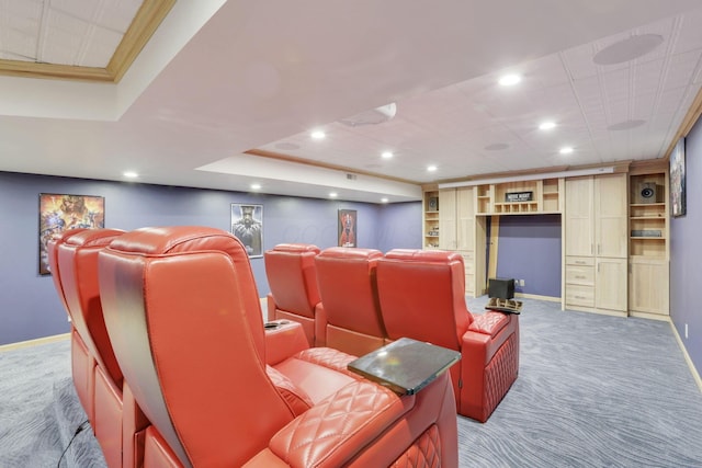 carpeted home theater with baseboards, a tray ceiling, and recessed lighting