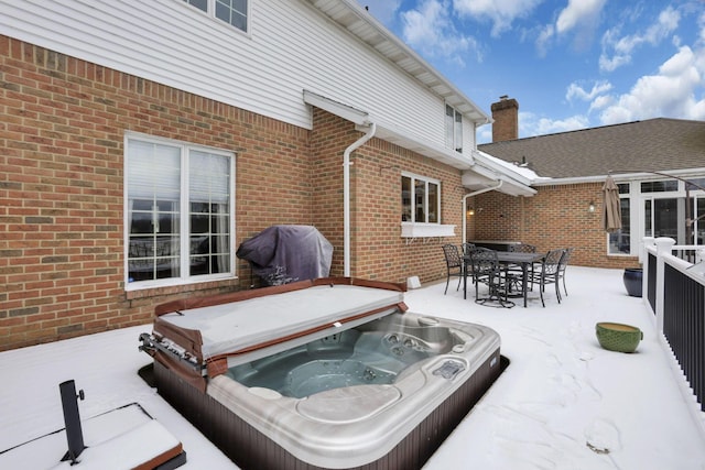 view of patio / terrace with a covered hot tub and area for grilling