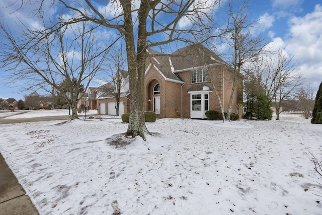 traditional-style house featuring brick siding