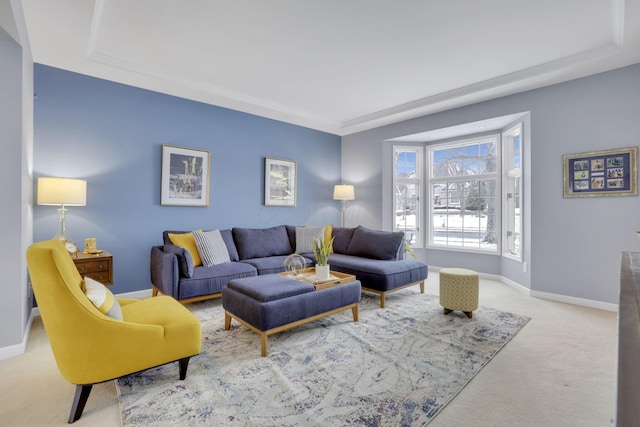 living area featuring carpet floors and baseboards