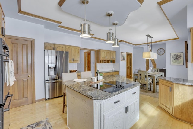 kitchen featuring black appliances, light wood-style flooring, light stone counters, and ornamental molding