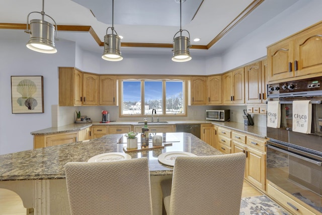 kitchen with light stone counters, a breakfast bar area, a sink, stainless steel appliances, and backsplash