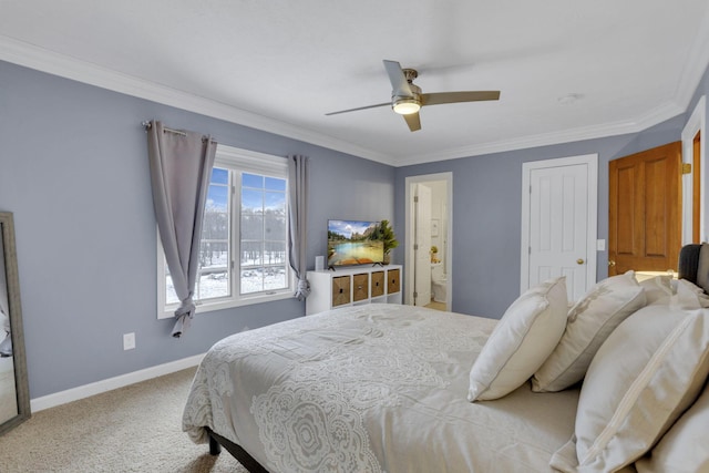 carpeted bedroom featuring a closet, ensuite bathroom, ornamental molding, ceiling fan, and baseboards