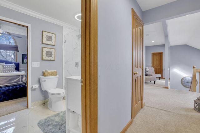 ensuite bathroom with baseboards, toilet, lofted ceiling, ensuite bath, and crown molding