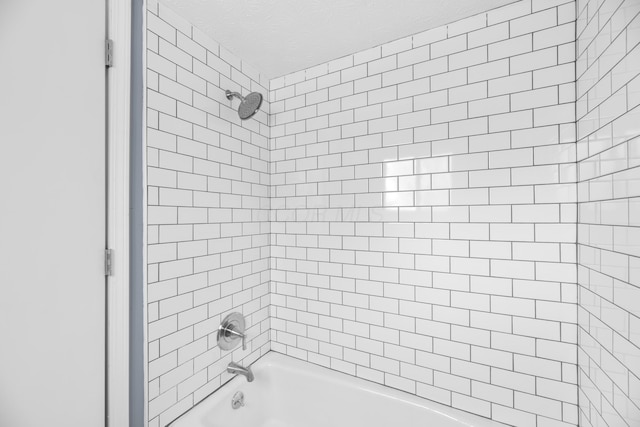 bathroom with shower / bathing tub combination