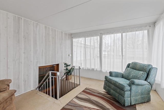 living area featuring an upstairs landing