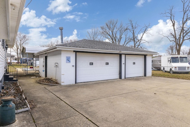 detached garage with fence