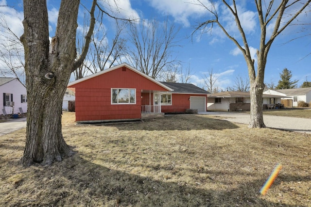 view of property exterior featuring a garage and driveway