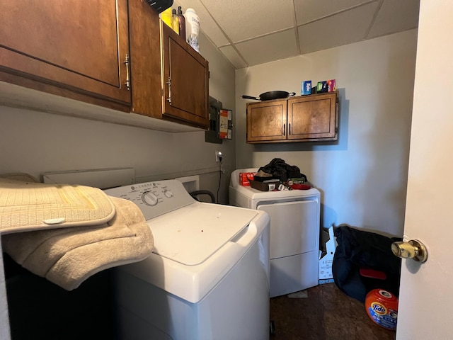 washroom with cabinet space and separate washer and dryer