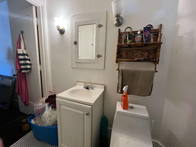 bathroom with vanity and toilet