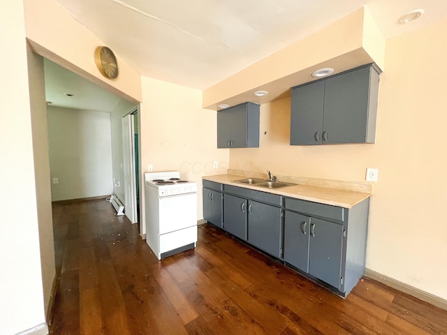 kitchen featuring a sink, baseboard heating, gray cabinets, white range with electric cooktop, and dark wood finished floors