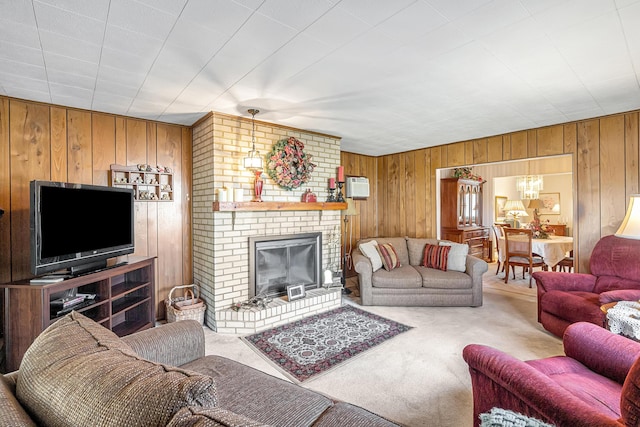 carpeted living room featuring a fireplace and wooden walls