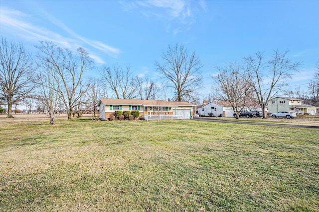 view of front of house with covered porch and a front yard