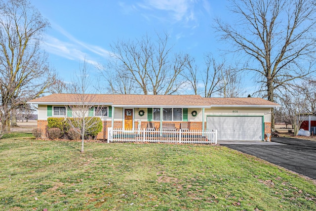 ranch-style house with a garage, aphalt driveway, covered porch, a front yard, and brick siding