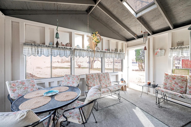 sunroom with lofted ceiling with skylight and wooden ceiling