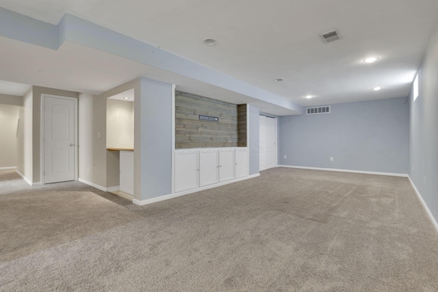 interior space with recessed lighting, visible vents, baseboards, and carpet flooring