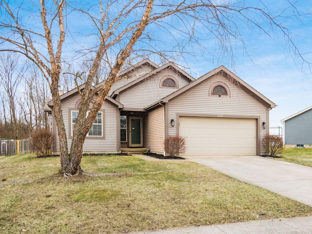 view of front of property featuring an attached garage, fence, a front lawn, and concrete driveway