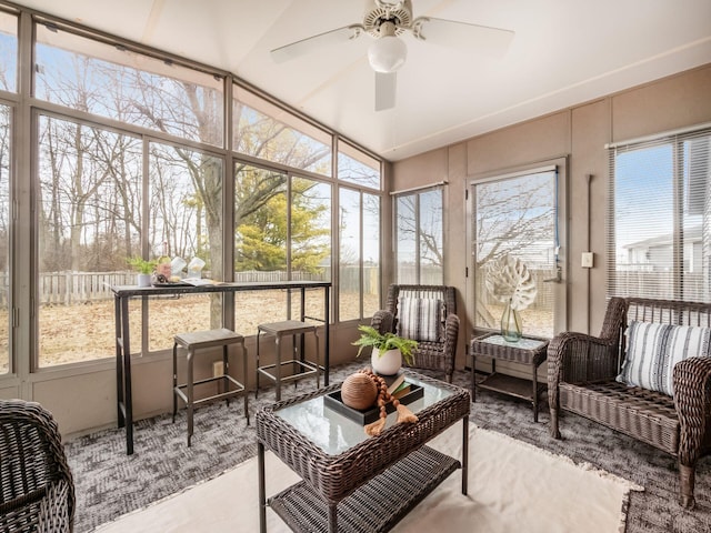 sunroom featuring a ceiling fan and a wealth of natural light