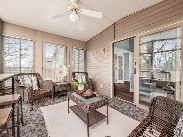 sunroom / solarium with lofted ceiling and ceiling fan