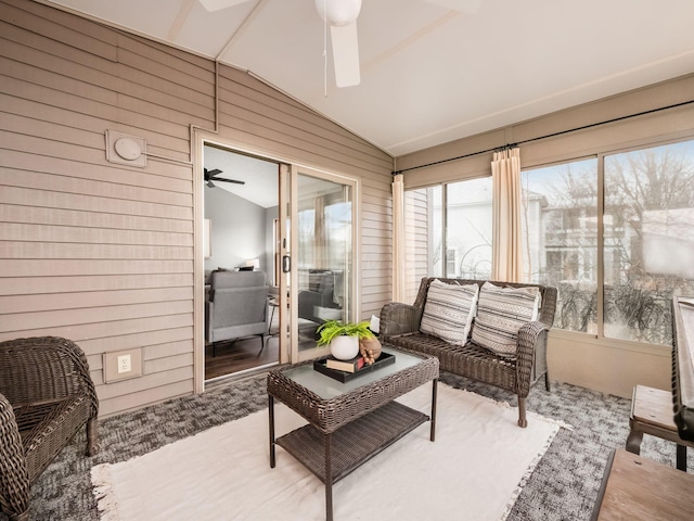 sunroom / solarium with lofted ceiling and ceiling fan