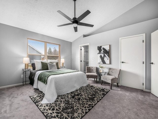 bedroom featuring baseboards, lofted ceiling, ceiling fan, a textured ceiling, and carpet flooring