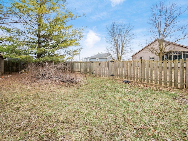 view of yard with a fenced backyard