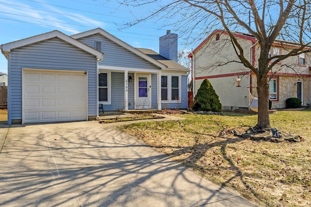 view of front of home featuring a garage, driveway, a chimney, and covered porch