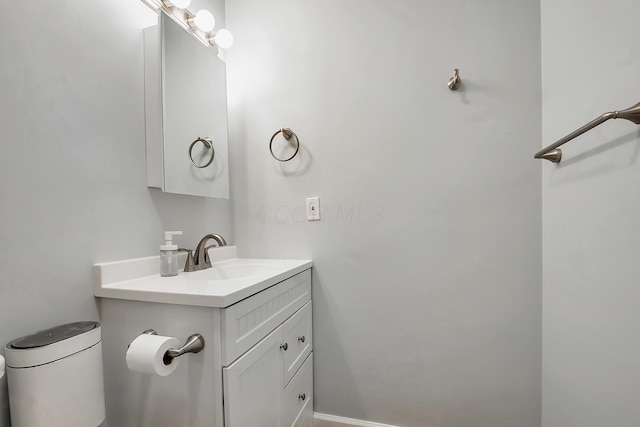 bathroom featuring vanity and baseboards