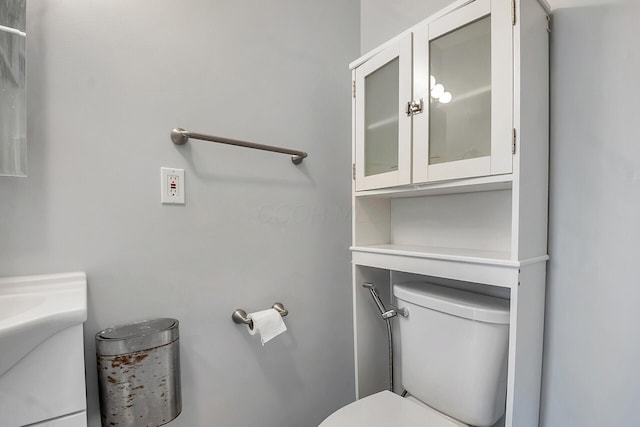 bathroom featuring toilet and vanity