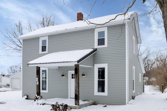 32 Railroad St, Jeffersonville, OH 43128 - view of front of home with a chimney