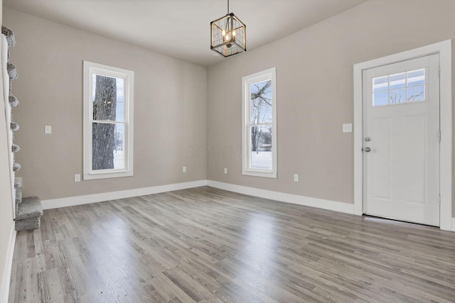 32 Railroad St, Jeffersonville, OH 43128 - entryway featuring plenty of natural light, wood finished floors, a chandelier, and baseboards