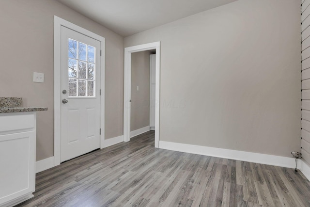 32 Railroad St, Jeffersonville, OH 43128 - doorway to outside featuring light wood finished floors and baseboards