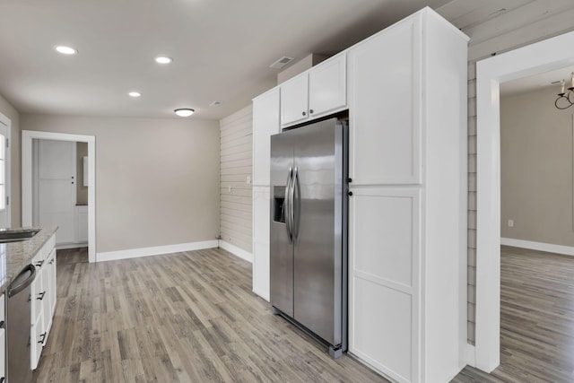32 Railroad St, Jeffersonville, OH 43128 - kitchen with stainless steel appliances, baseboards, light stone counters, light wood finished floors, and recessed lighting