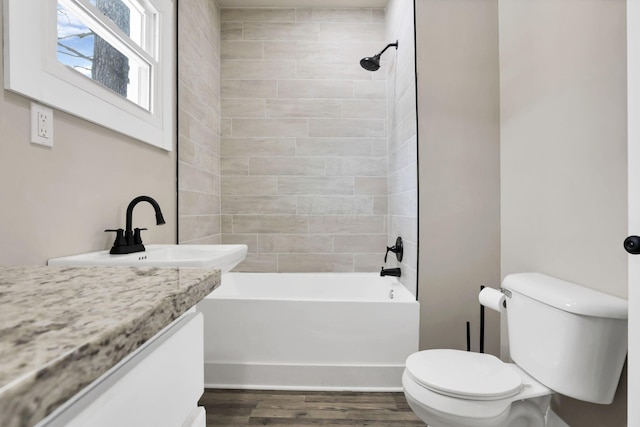32 Railroad St, Jeffersonville, OH 43128 - full bath featuring vanity, toilet,  shower combination, and wood finished floors