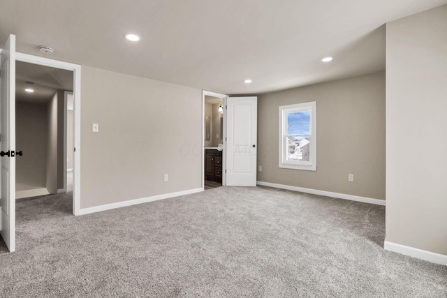32 Railroad St, Jeffersonville, OH 43128 - unfurnished bedroom with carpet flooring, baseboards, recessed lighting, and ensuite bathroom