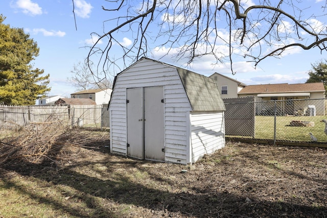 view of shed featuring a fenced backyard