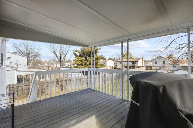 wooden terrace featuring a residential view and grilling area