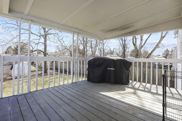 deck featuring an outbuilding and a storage unit