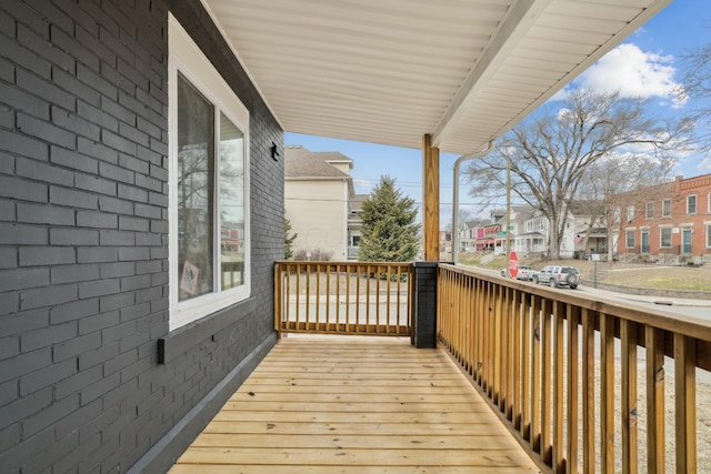 wooden terrace with a residential view